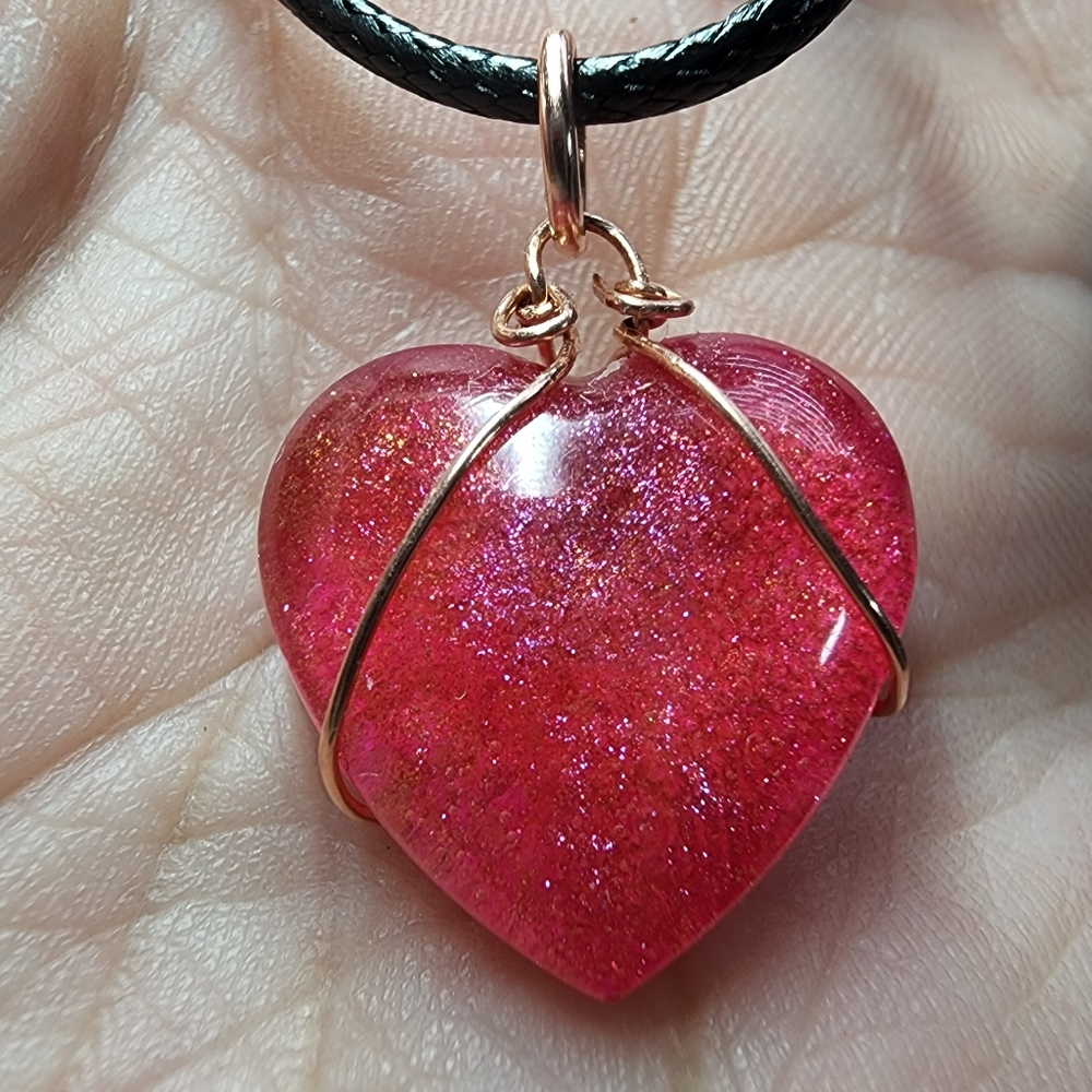 NWOT handcrafted resin heart neclace wrapped in copper, black neck cord included